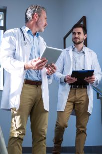 doctors-interacting-with-each-other-on-staircase-2021-08-28-22-12-48-utc-Custom-1-e1644554703900.jpg